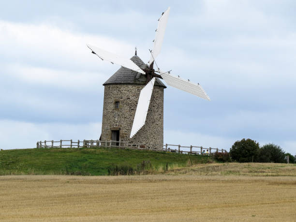 istock Normandy, France. A typical Mill in the field. 898185696