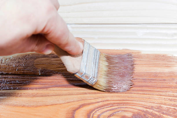 istock Brush in the brown paint, paint a tree. 898185838