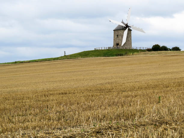 istock Normandy, France. A typical Mill in the field. 898186490