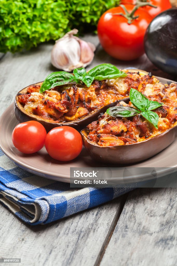 Baked eggplant with pieces of chicken Baked eggplant with pieces of chicken in tomato sauce Arabic Style Stock Photo