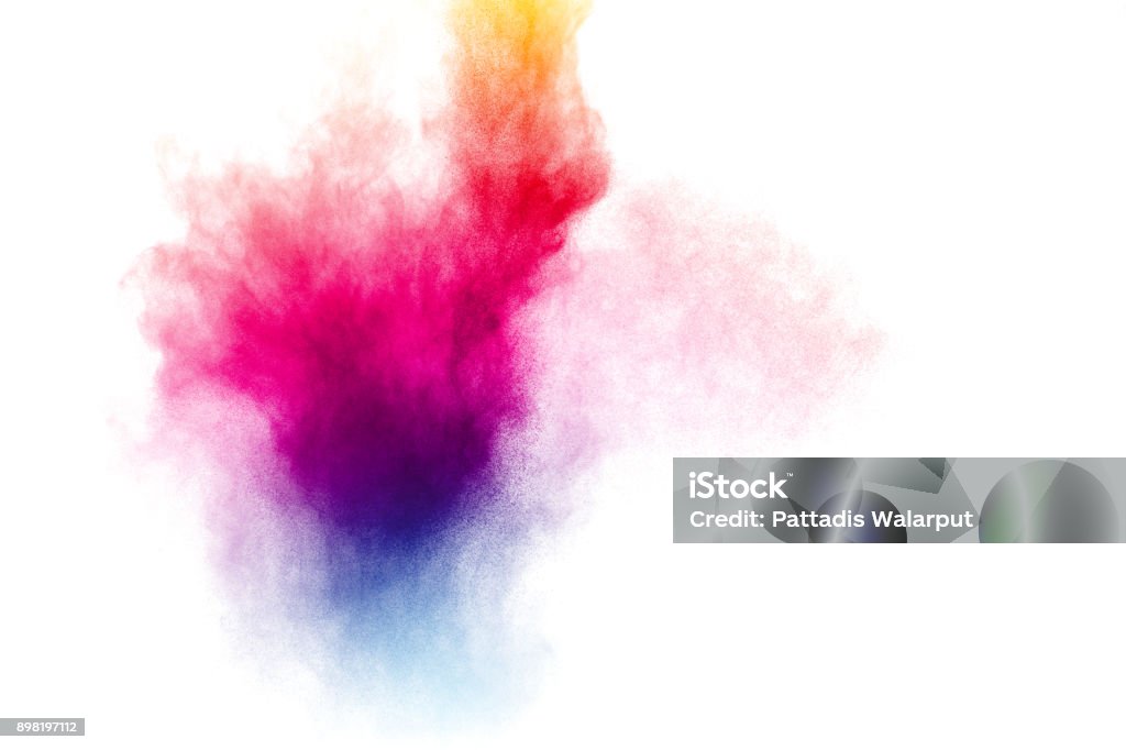 abstract multicolored powder splatter on white background,Freeze motion of color powder explosion on white background. Colors Stock Photo