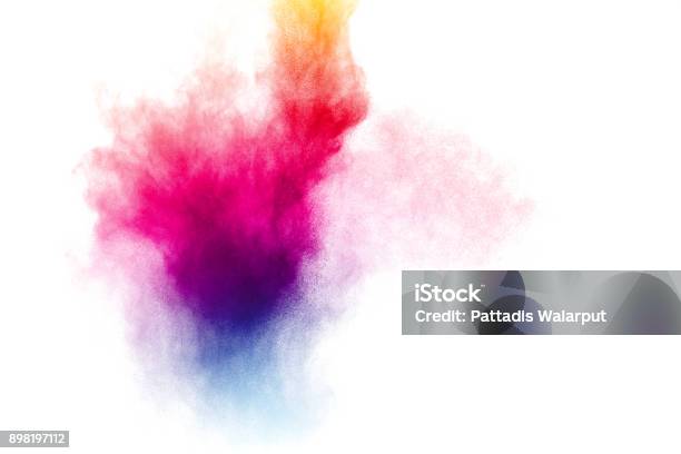 Abstract Multicolored Powder Splatter On White Background Freeze Motion Of Color Powder Explosion On White Background Stock Photo - Download Image Now