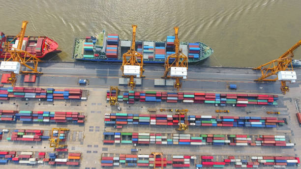 istock Logistics and transportation of Container Cargo ship and Cargo working crane bridge in shipyard 898200580