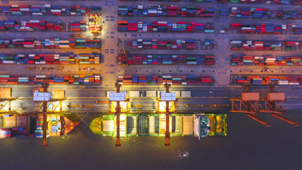 istock Logistics and transportation of Container Cargo ship and Cargo working crane bridge in shipyard 898200610