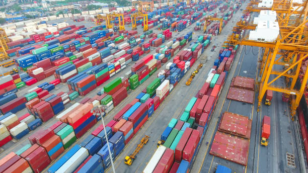 istock Logistics and transportation of Container Cargo ship and Cargo working crane bridge in shipyard 898200676