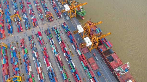 istock Logistics and transportation of Container Cargo ship and Cargo working crane bridge in shipyard 898200714