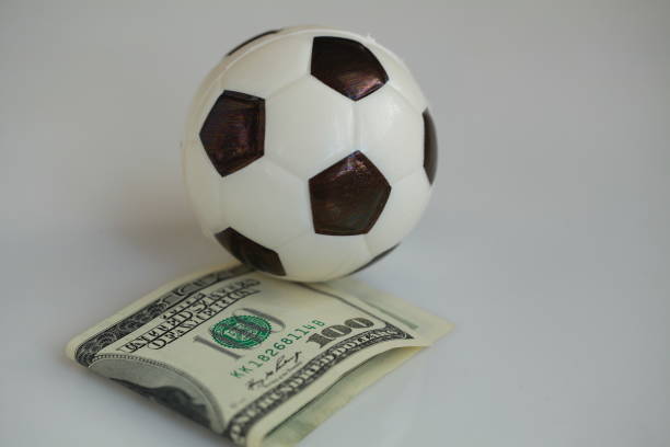 istock football ball and dollars contractual match bookmaker 898203766