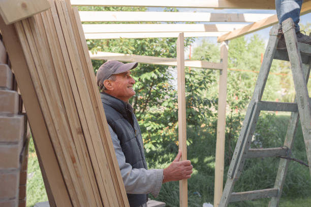 istock Elder man enjoying helping in the house construction process 898209628