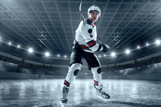 istock Ice hockey player on big professional ice arena 898211028