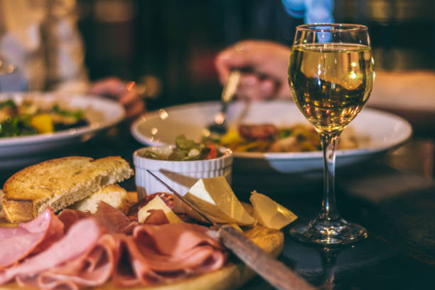 Cold cuts and wine Shot of a table during a meal italian culture stock pictures, royalty-free photos & images