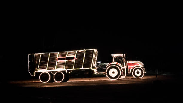 istock Tractor with christmas lights in the dark 898214200