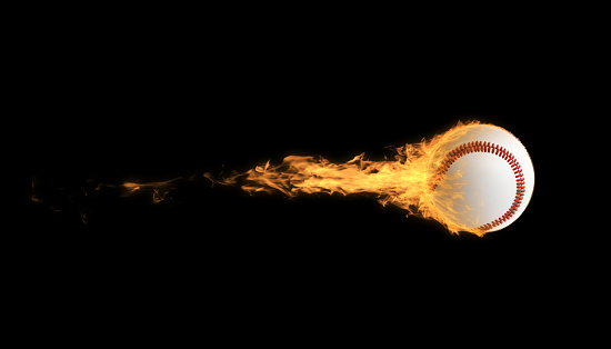 Baseball soccer ball in flames over black background. Horizontal composition with copy space.