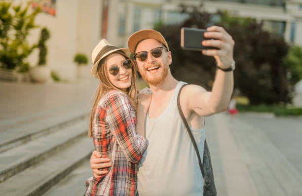 istock Happy young couple taking a selfie together on a summer day 898217710