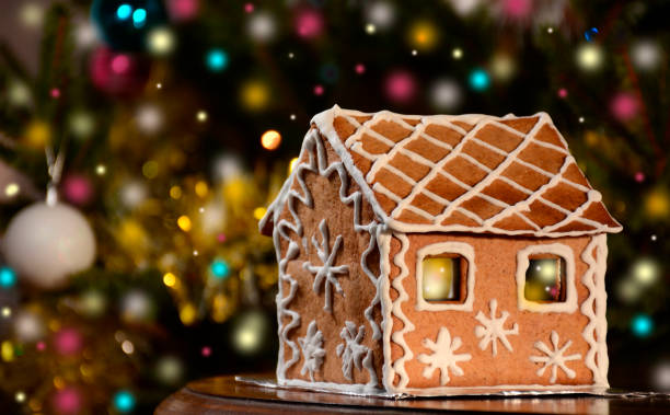 istock Gingerbread house with lights on christmas background 898219202