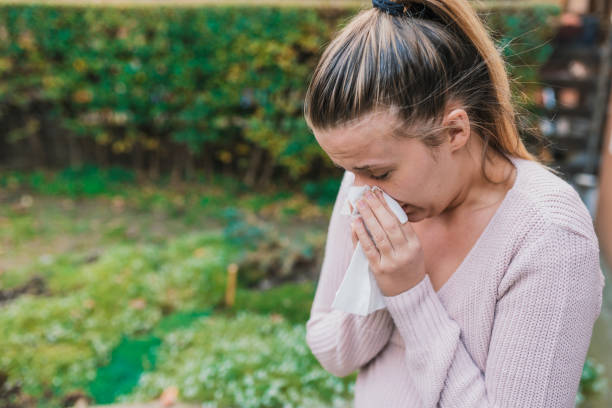 istock Sick girl has runny nose 898219706