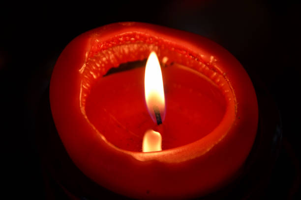 istock flame of a red candle 898219782