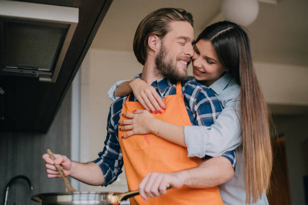 istock Boyfriend and girlfriend hugging each other in the kitchen 898225866