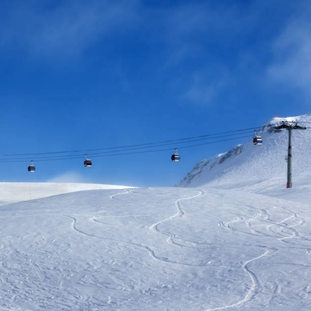 istock Gondola lift and ski slope for freeriding 898226800