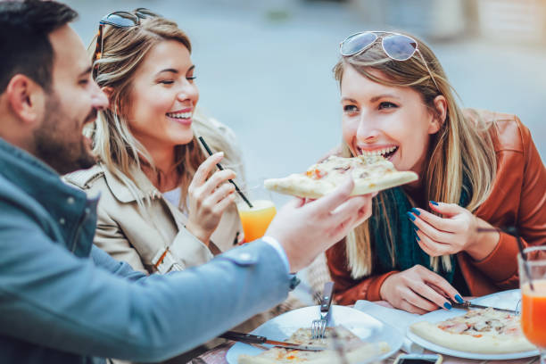 istock Friends eating pizza. 898227250