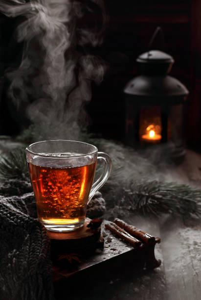 istock cup of boiling black tea in winter decorations 898227408