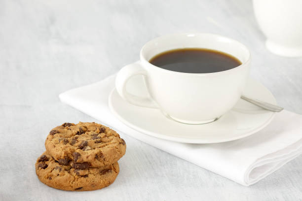 istock Cup of coffee and cookies on the table. 898233402