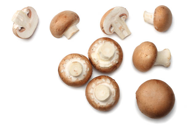 istock Fresh champignon mushrooms isolated on white background. top view 898238770
