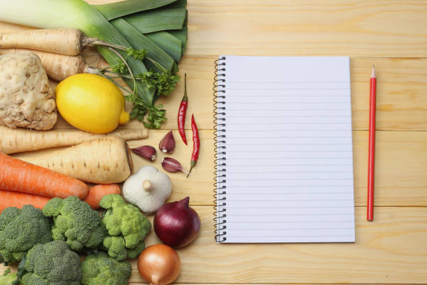 istock Fresh vegetables on light wooden background. Mockup for menu or recipe. Top view with copy space 898238812