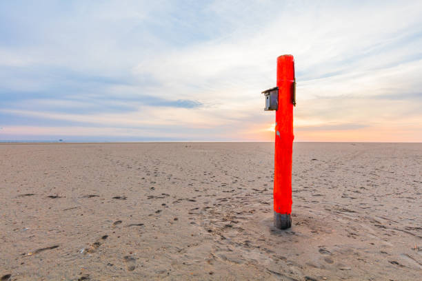 The stunning beach of St. Peter-Ording with a red beacon. This beach is located at the west coast of Schleswig-Holstein and is said to be the widest beach in Europe. 50 Mpx image taken with Canon EOS 5Ds and Ef 11-24mm.