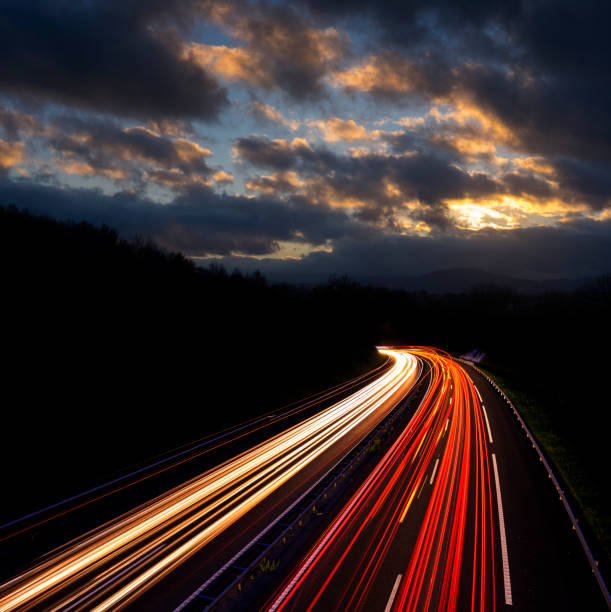 istock Car lights and truck on the freeway 898245620