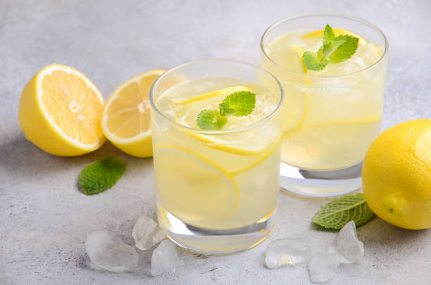 istock Lemon drop cocktail on a gray concrete background 898246202