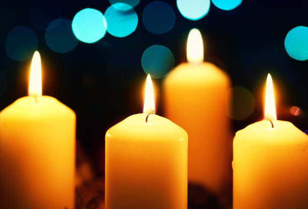 istock Four candles with christmas decoration 898246638
