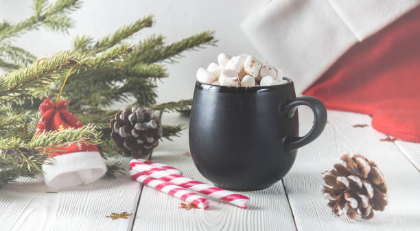istock black mug with marshmallow and candy on wooden background 898246778