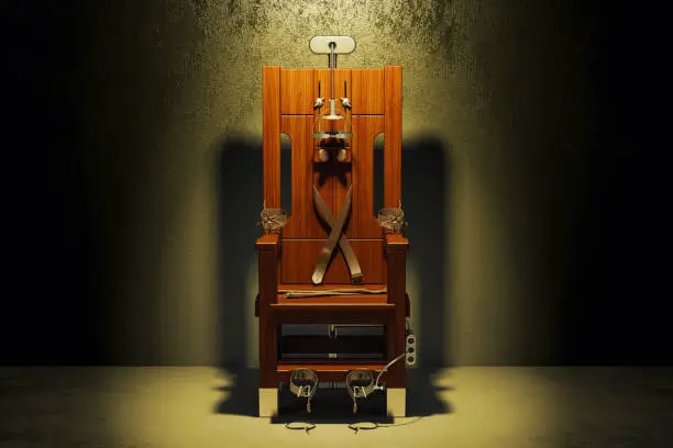 Photo of Electric chair in the dark room, 3D rendering