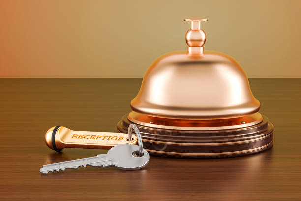 istock Hotel key and reception bell on the wooden table, 3D rendering 898247492