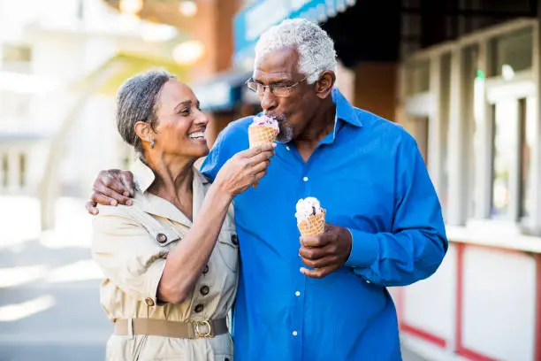 Photo of African American Senior Couple On the Town with Ice Cream