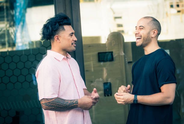 istock Two New Zealand men outdoors talking and laughing at work. 898248308