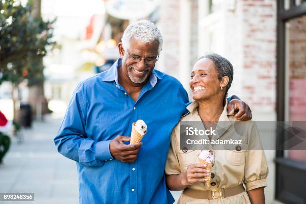 African American Senior Couple On The Town With Ice Cream Stock Photo - Download Image Now