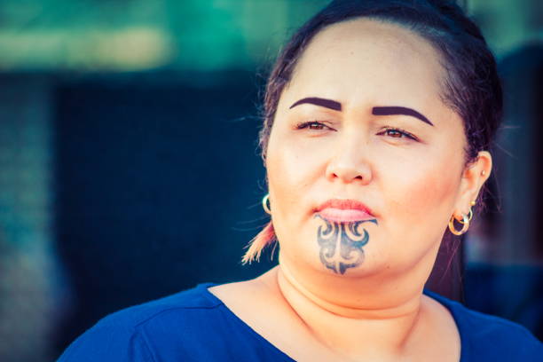 Close up portrait of a Maori business woman outdoors in the workplace. stock photo