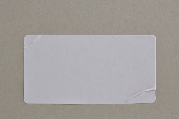 istock Stickers Label Close Up on Cardboard Background with Real Shadow. 898249638
