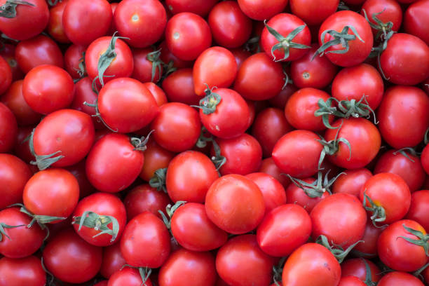 istock Fresh and Juicy Cherry Tomatoes on Stall 898251364