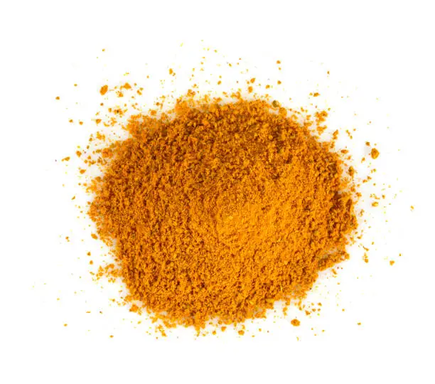 Photo of curry powder isolated on white background