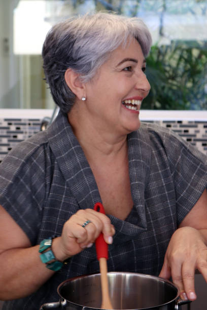 istock Senior woman cooking 898253686
