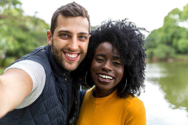 istock Couple taking selfie in the park 898257740