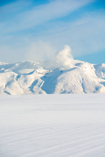 istock Mountain peak with volcanic smoke Mt.Tokachidake 898260738