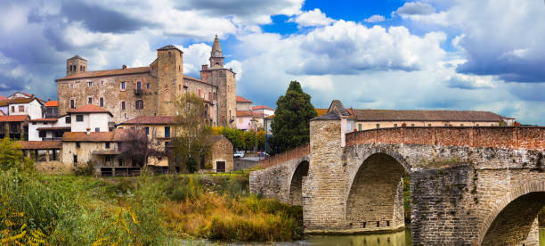 istock impressive medieval Bormida monastery and castle in regione Asti in Piemonte, Italy 898264974