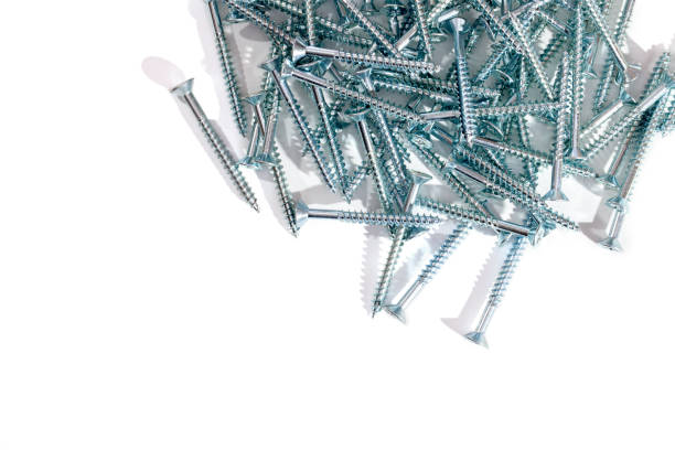 istock DIY silver woodscrews close up against white background with copy space. 898265880