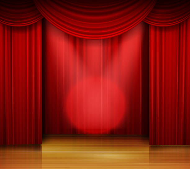 istock Empty stage with red curtain and spotlight on wooden floor 898266172