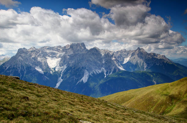 istock Grassy Carnic Alps and jagged Sexten Dolomites, Italy 898266720