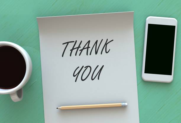 istock THANK YOU, message on paper, smart phone and coffee on table 898268030