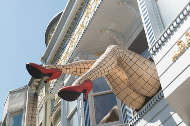 In San Francisco, USA a pair of giant legs wearing red high heels and fishnet stockings sticking out of the second floor of a Victorian building on the famous Haight Street are a local landmark.